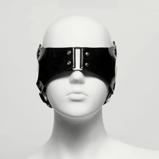 Black rubber blindfold with metal studs and accents on a mannequin white head against a white background
