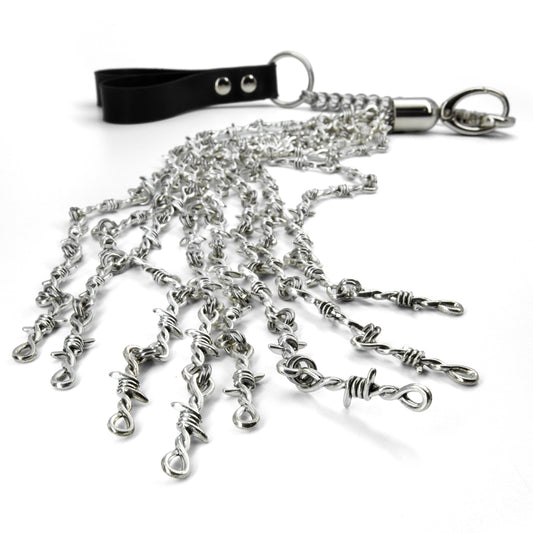 A close-up of the ends of the Kanuka barbed white finger flogger is shown on a white background.