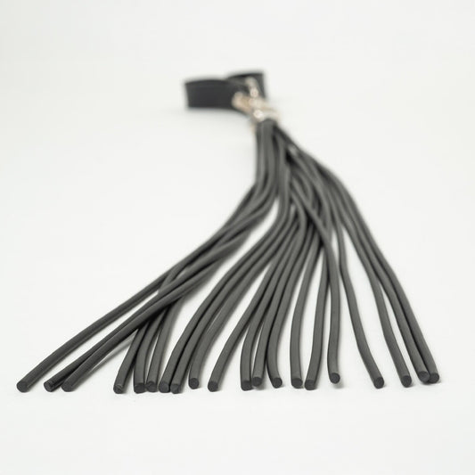 Black rubber flogger cord detailed close up on a white background