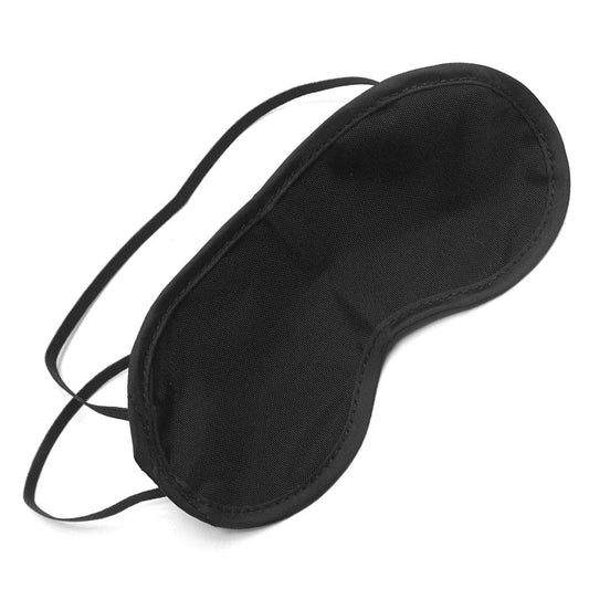Cathy’s Blindfold in black is displayed against a blank background. It is a BDSM blindfold made of shiny black nylon fabric with two thin, black elastic straps.