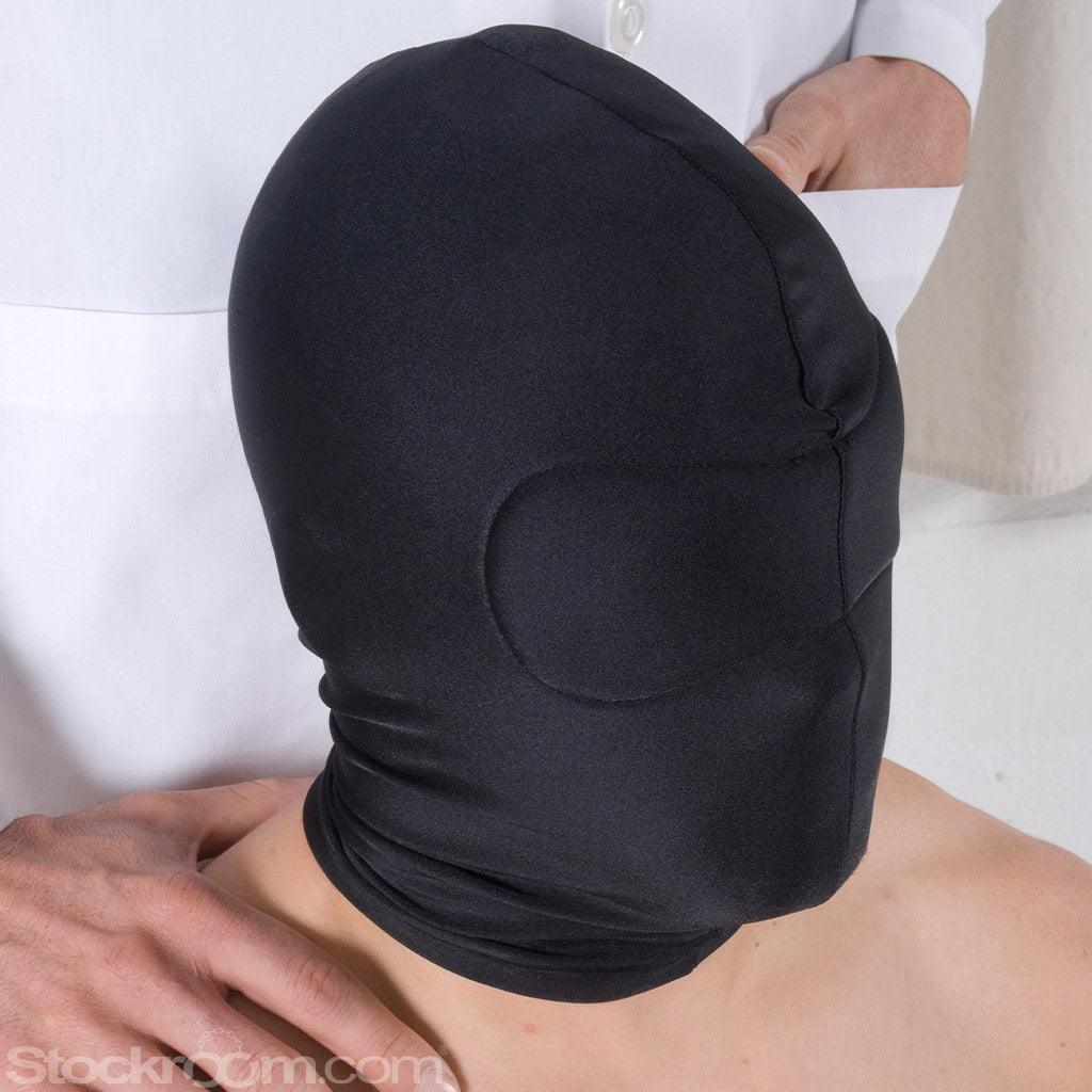 A close-up image of a nude man looking to the side. He is wearing the Spandex Hood with Blindfold.