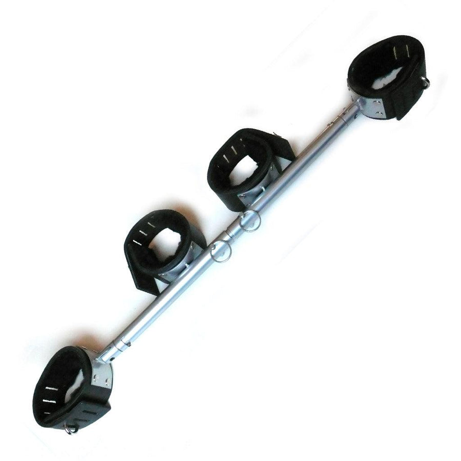 The chrome Adjustable Stocks are shown against a blank background. It is a chrome rod with two metal pins that can be moved to adjust the length of the bar. There are two black leather fleece-lined cuffs on each end and two in the middle.
