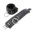 Load image into Gallery viewer, A pair of black Premium Fleece-Lined Leather Cuffs With A Locking Buckle is displayed against a blank background.
