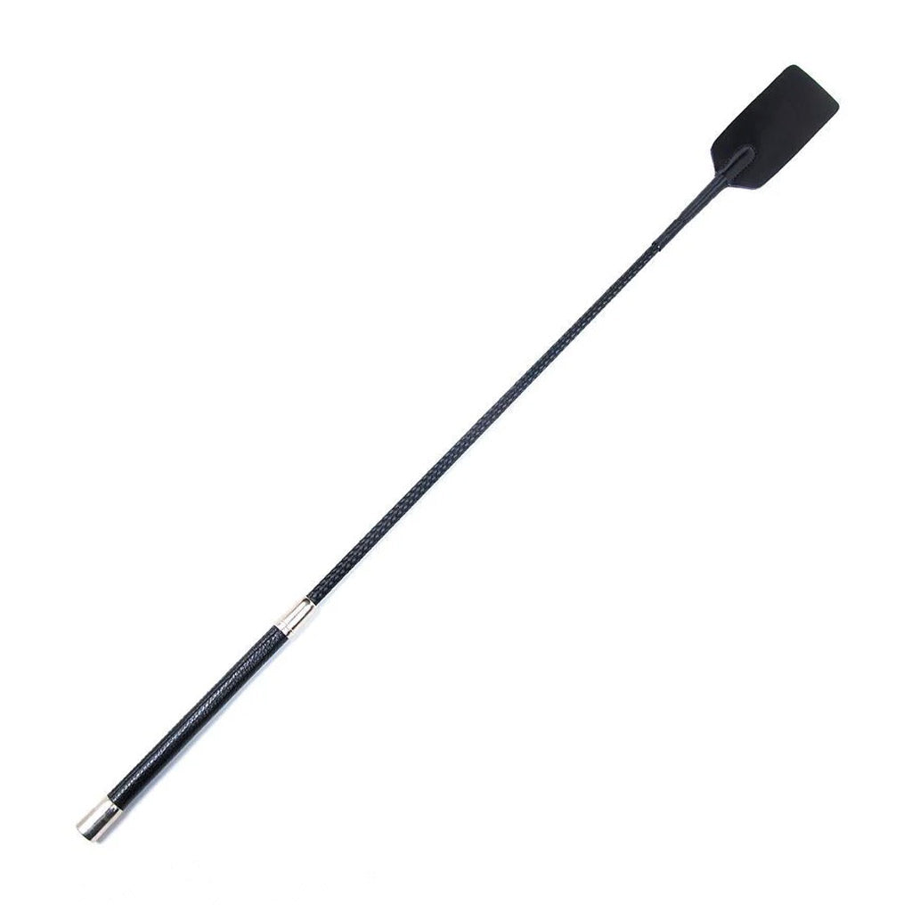 The Hog Slapper crop, which has a black handle, a black nylon rod, and a black leather square slapper at the end, is displayed against a blank background.