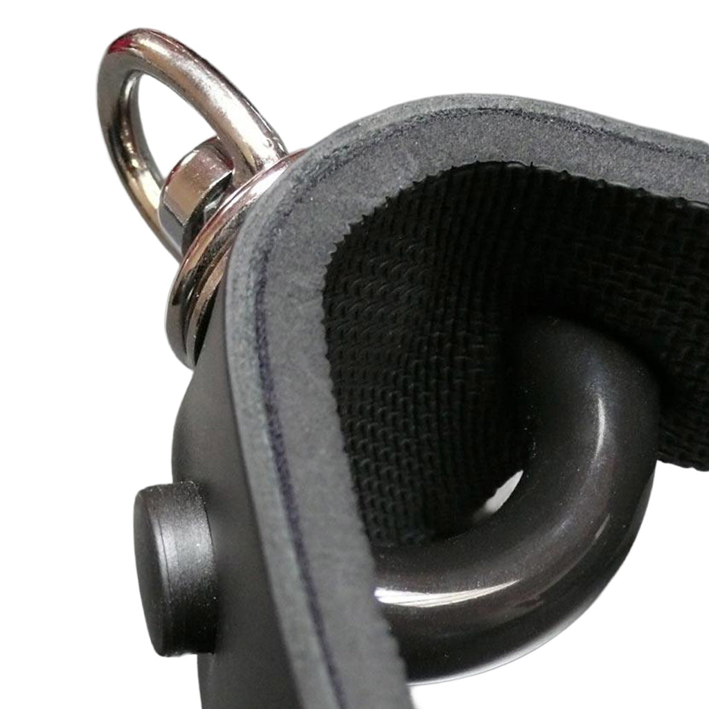 A close-up of the curved bit gag of the Half Moon Bit Gag By Scott Paul Designs is shown on a grey table.
