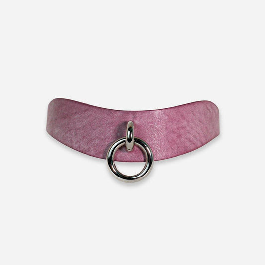 The Orbit Day Collar seen on a white background from a straight-on front view. The collar is made of a light lavender leather, with a nickel-plated ring in the exact center.