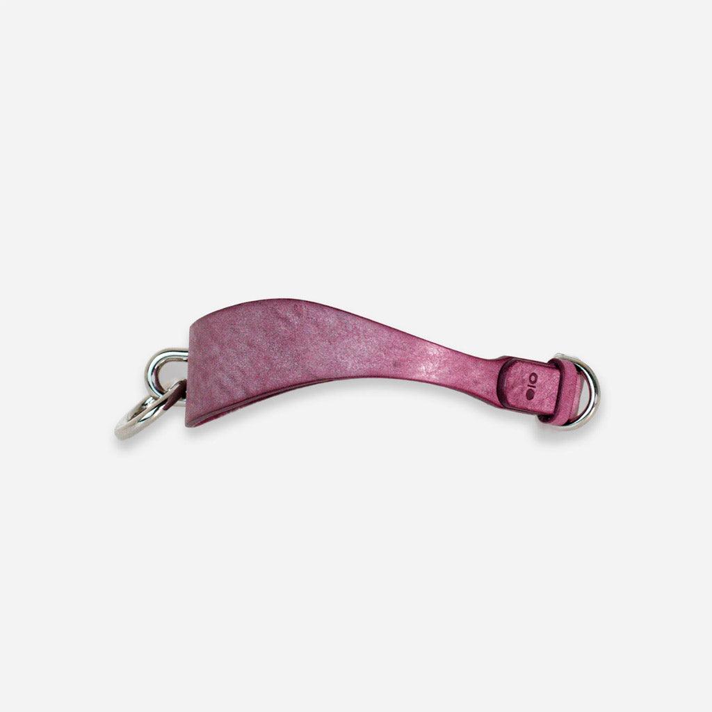 The Orbit Day Collar from Neon Coyotes seen from the side. The connecting ring can be seen in profile on the left side. On the right, the adjustable buckle is visible.