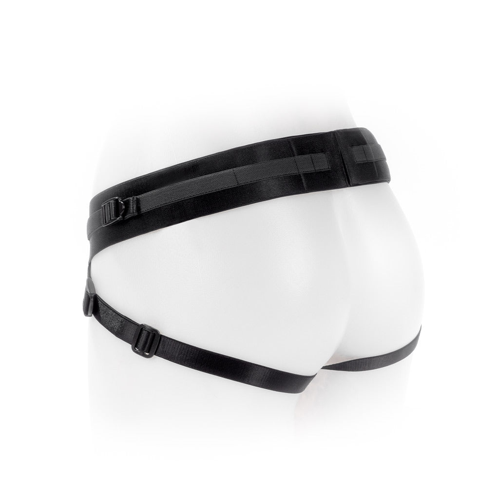 A white mannequin on a white background, showing the SpareParts Joque Dildo Harness from behind, its straps framing the thighs and buttocks.