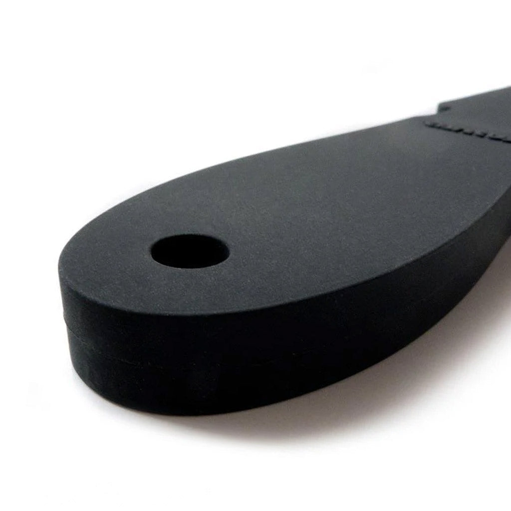 A close-up of the handle of the Wham Bam Tantus Paddle is displayed against a blank background. The handle has a small hole at the base.