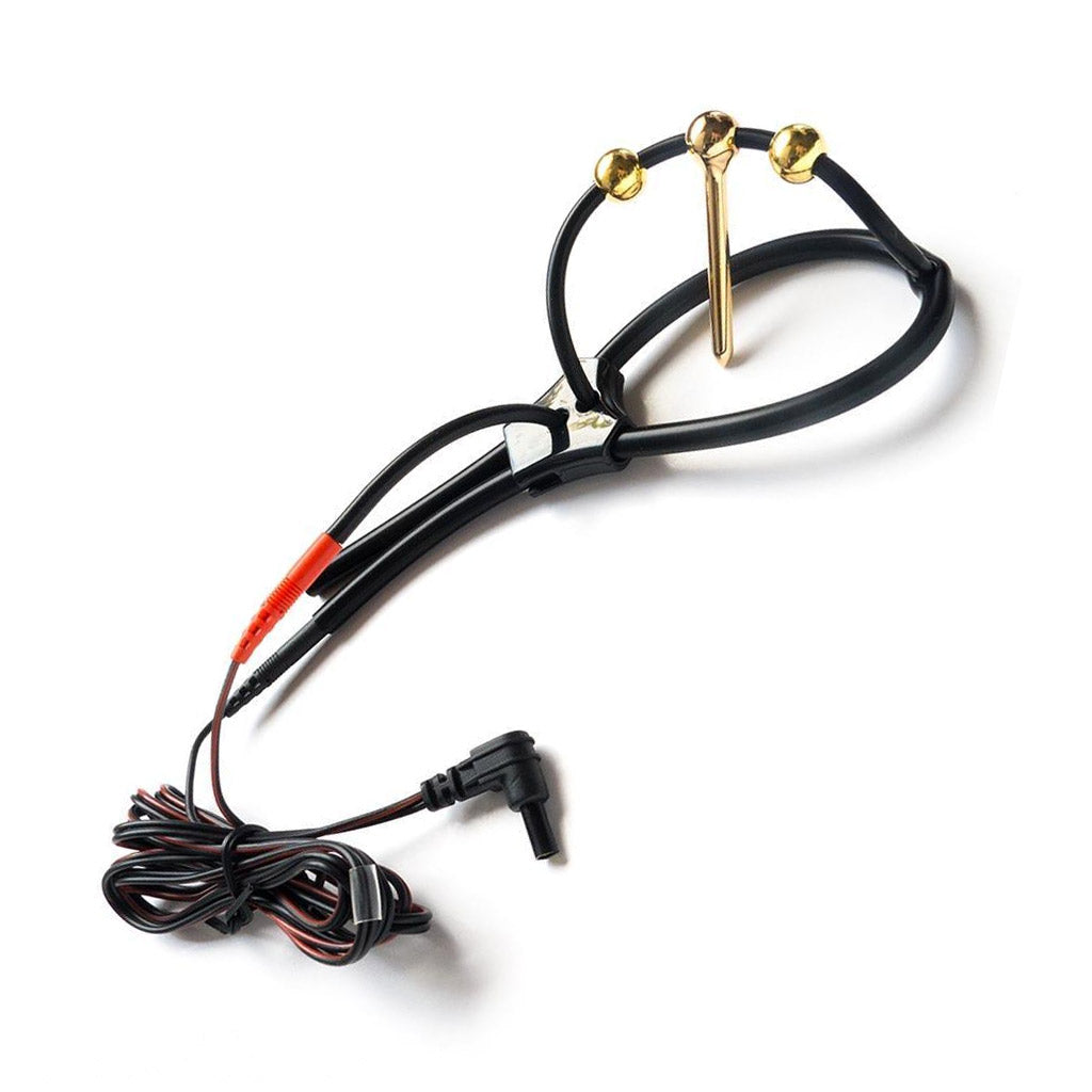 The Mystim Plunging Pete is displayed against a blank background. It is a ring with an arch over the top made of black silicone with three gold balls across the arch. The gold ball in the center has a rod sticking down.