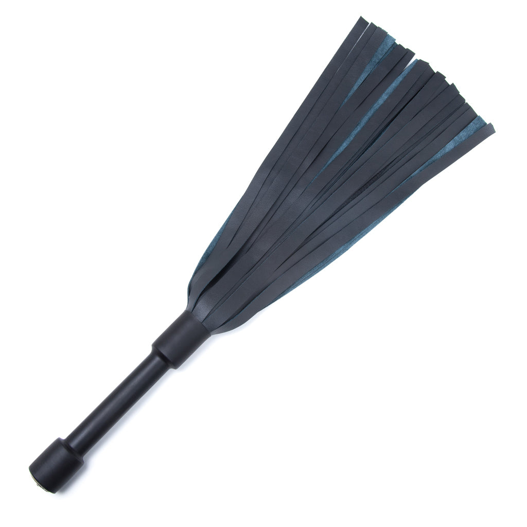 The Blue Devil Leather Flogger By Dragontailz is displayed against a blank background. The flogger has falls that are dark blue on one side and light blue on the other, as well as a black handle.