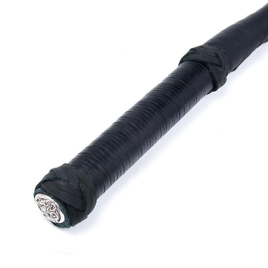 A close-up of the handle of the Black Dragon Tail Whip shows the ornate silver cap that covers the bottom of it.