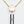 Load image into Gallery viewer, The bottom of the Vesper Pendant Necklace Vibrator is shown below a rose gold chain, which has a pendant with the Crave logo on it. The vibrator has one small button.
