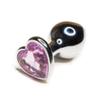 Load image into Gallery viewer, The Baby Pink Jewel Stainless Steel Heart Butt Plug is shown against a blank background. The plug is shiny silver and is tapered with a thin neck and wide base. The base is heart-shaped with a light pink heart-shaped gem embedded in it.