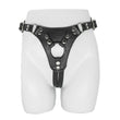 Load image into Gallery viewer, The Minx Licorice Leather Strapon Harness is displayed on the lower half of a mannequin against a blank background. The harness is made of black leather and has silver rivits on the seams.