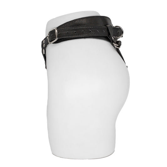 The Minx Licorice Leather Strapon Harness is displayed from the side on the lower half of a mannequin against a blank background. It has an adjustable buckle on the side.
