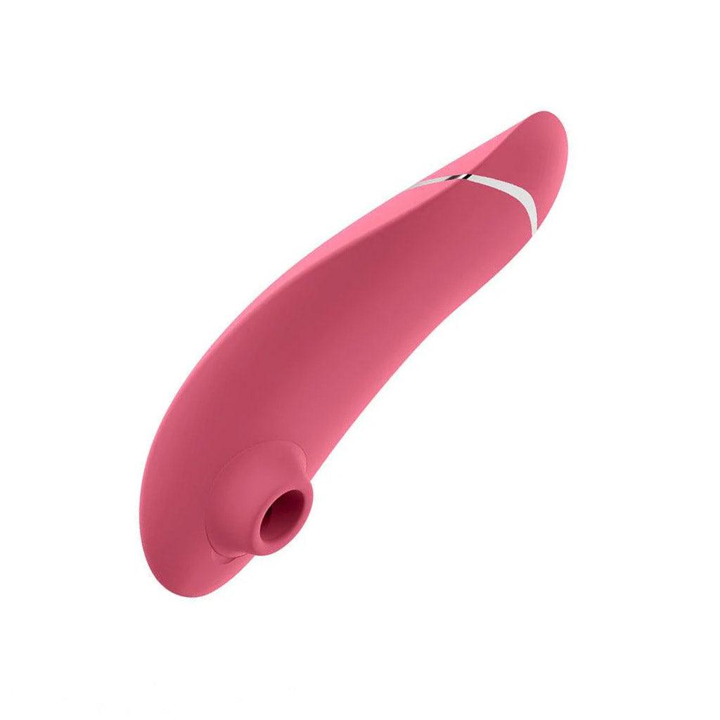 The Womanizer Premium 2 Vibrator in raspberry pink color, shown on a white background. It is seen from the front, so the suction point can be seen clearly.