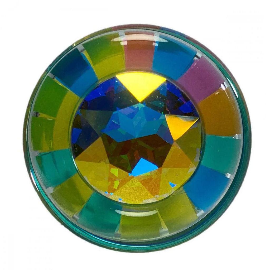 The base of the Funfetti Butt Plug With Crystal Base is shown against a blank background. The crystal is iridescent.