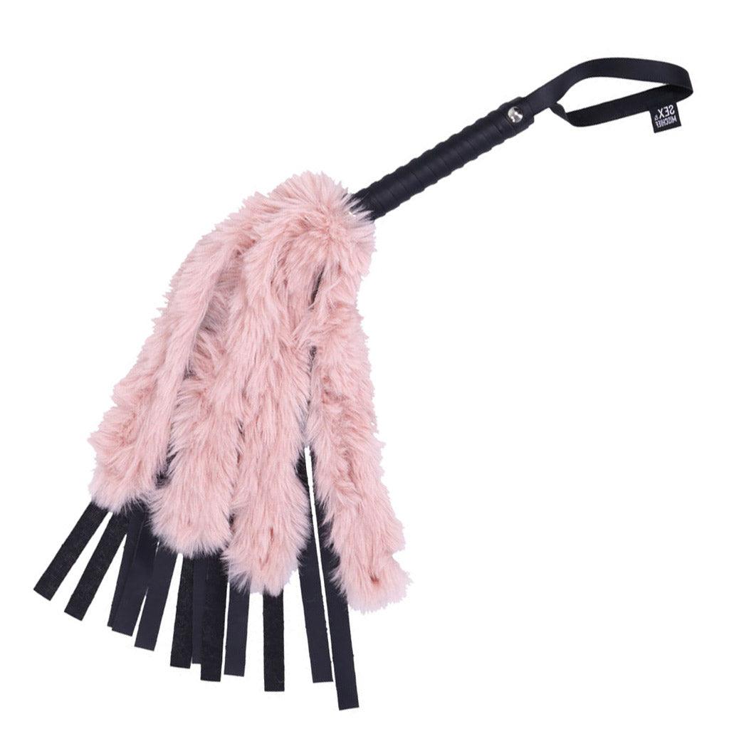 Product photo against a white background, showing the Brat Faux Fur Flogger bent slightly at an angle.