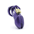 Load image into Gallery viewer, A chastity cage made of purple glitttery plastic, with a brass padlock on the top.
