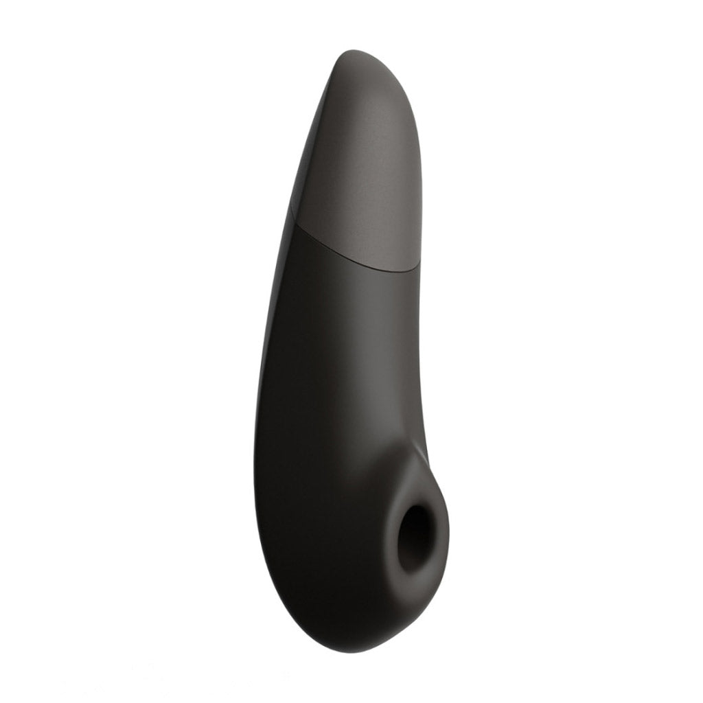 The Womanizer Enhance vibrator in semi-profile, showing the full shape and the suction cup.
