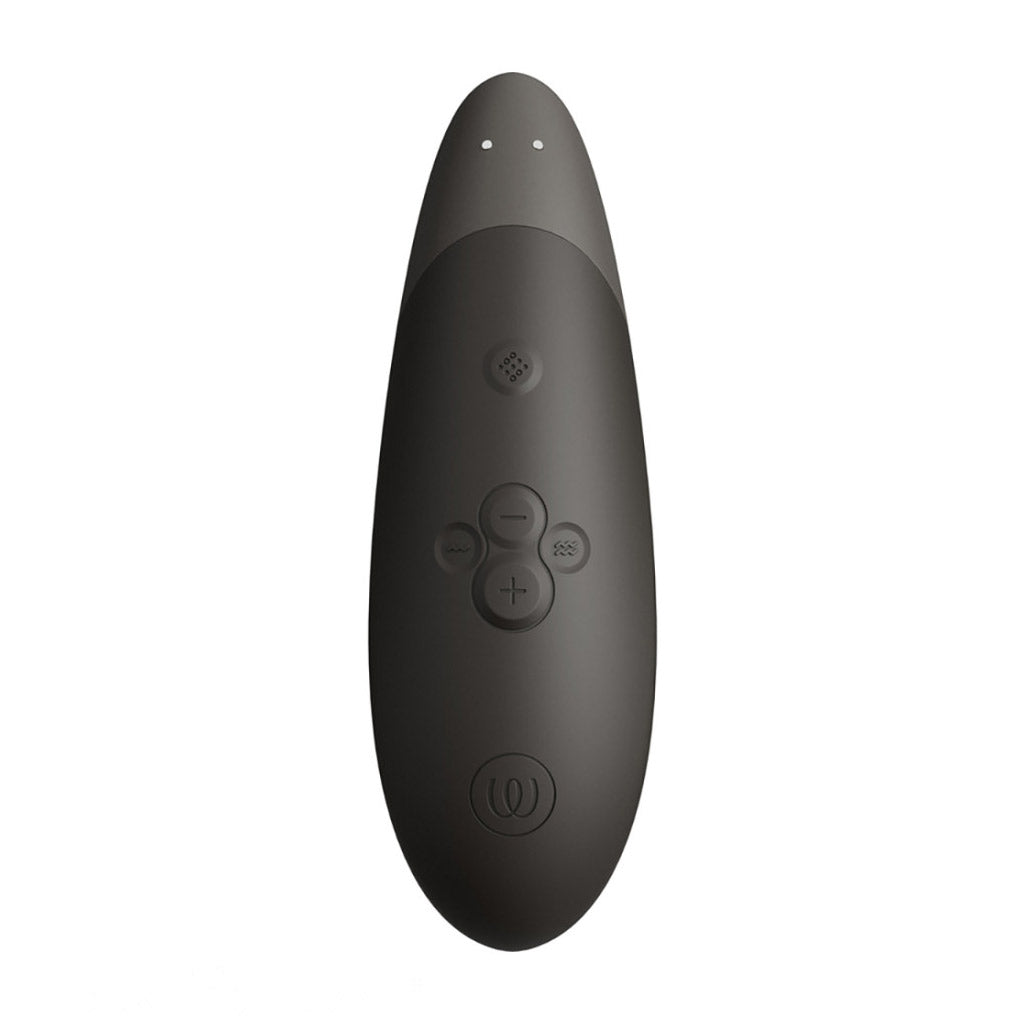 The Womanizer Enhance vibrator, seen directly from the back to display the charging contact points and the controls.