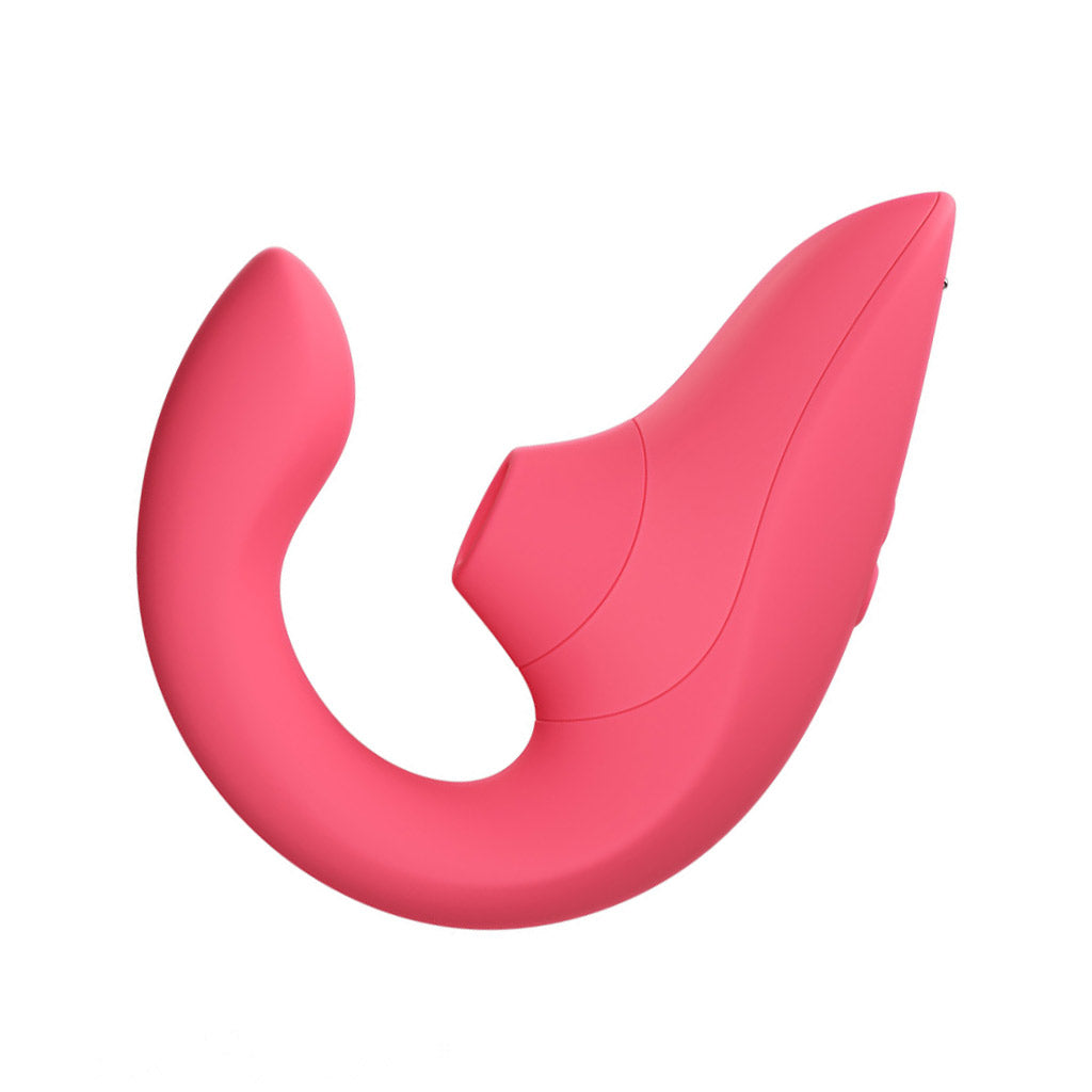 A Womanizer Blend suction vibrator in bright pink color, seen from the side on a white background.