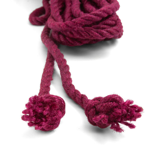 The knotted ends of the wine colored jute waxed rope are shown on a white background.