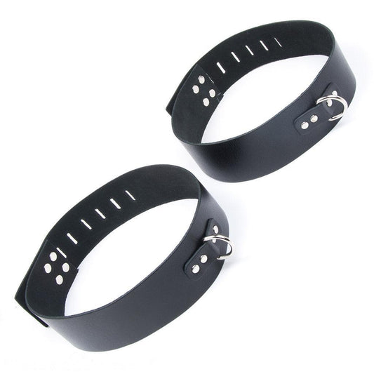 The black Leather Thigh Cuffs are shown against a blank background. They each have a D-ring in the front.