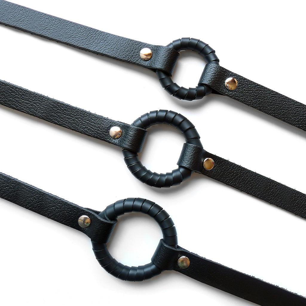 Three O-Ring Gags are shown against a blank background, with the smallest size on top and the largest on the bottom.