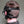 Load image into Gallery viewer, A close-up of the back of a man&#39;s head in the Inescapable Head Harness is shown in front of a grey background. The black leather harness goes around the sides of his head and has loops near the ears. It also has an attached blindfold.
