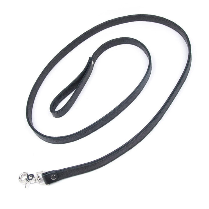 The black Leather Leash is shown against a blank background. It is a thin strip of black leather with a wrist loop on one end and a snap hook on the other.