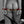 Load image into Gallery viewer,  A close-up of a nude woman’s butt and thighs is shown with a man pulling down her underwear. Her wrists are cuffed behind her back with the Melanie Rose Designs x The Stockroom Restraint Clip, which attaches the matching wrist cuffs she’s wearing together.
