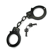 Load image into Gallery viewer, The black Kinklab Basic Handcuffs are displayed against a blank background along with their keys. They resemble basic police cuffs with a short connecting chain.