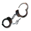 Load image into Gallery viewer, The silver Kinklab Double-Lock Police-Style Handcuffs are displayed against a blank background along with their keys. They resemble basic police cuffs with a short connecting chain.