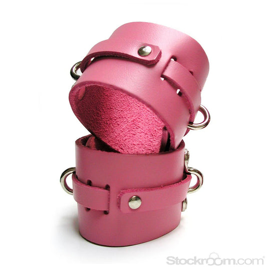 The pink kinklab leather ankle cuffs are shown on a white background, stacked on top of each other.