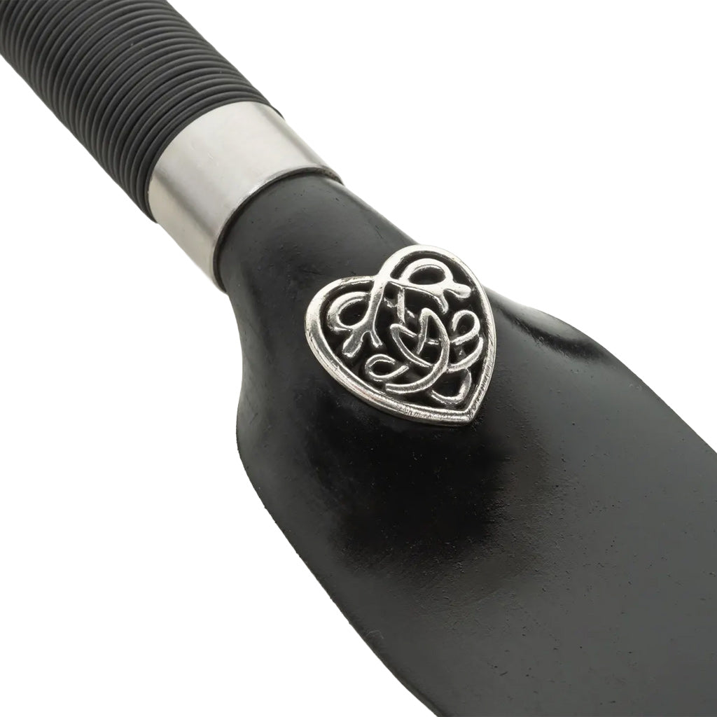 Black handle with silver heart-shaped emblem on a white background