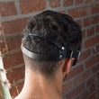 Load image into Gallery viewer, The back of a brunette man’s head with the Mistress Heather Leather Blindfold on is shown.