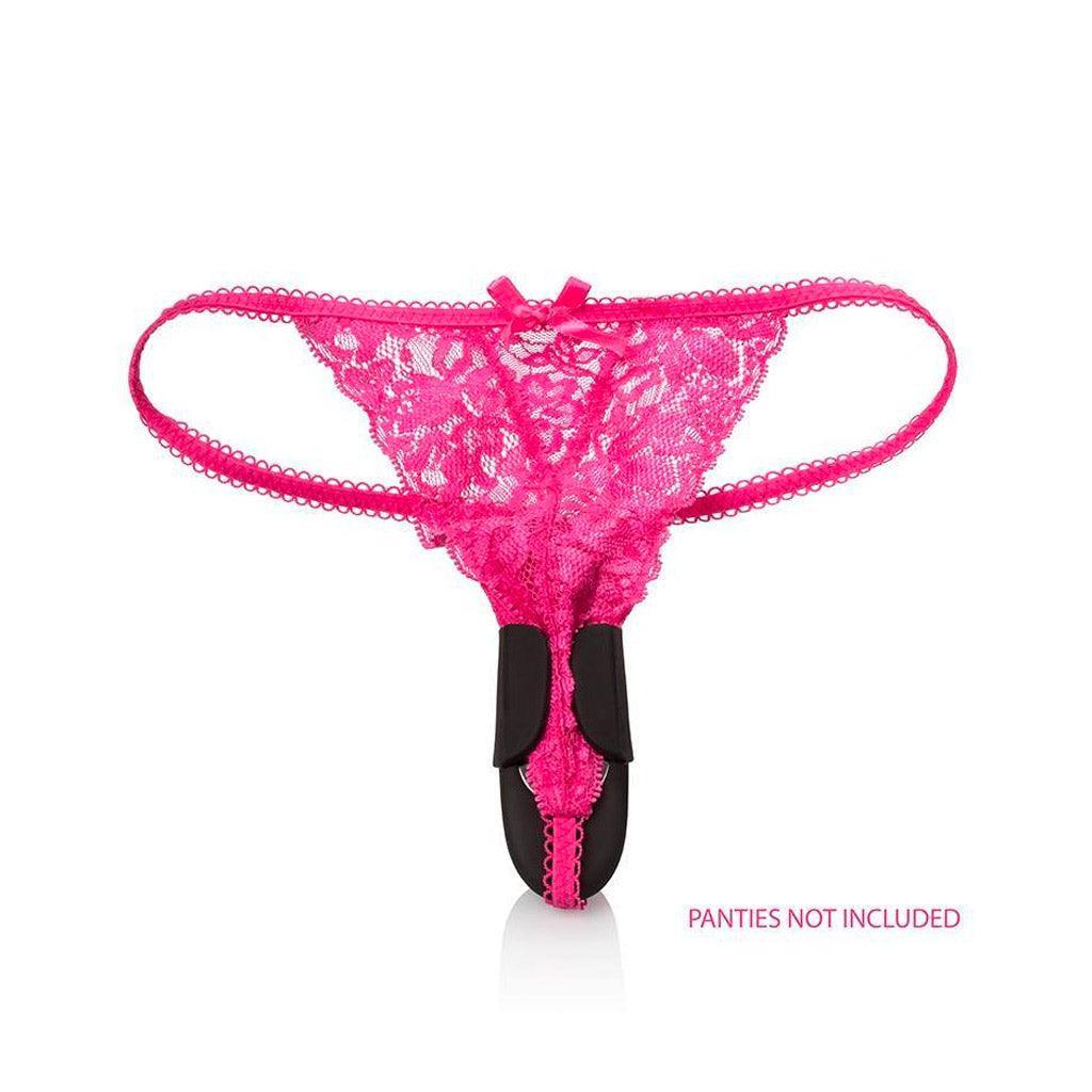 A pair of lacey, hot pink thong panties are shown against a blank background. The Lock-N-Play Remote Petite Panty Teaser is shown on the panties, with the vibrator on the inside and the small black wings folded over the edges of the panties to secure it.