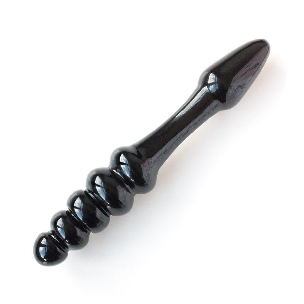 The Black Arrow glass dildo seen from the side on a white background.
