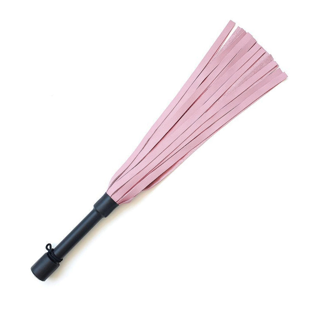 The Pink Devil Leather Flogger By Dragontailz is displayed against a blank background. The flogger has light pink falls and a black handle.