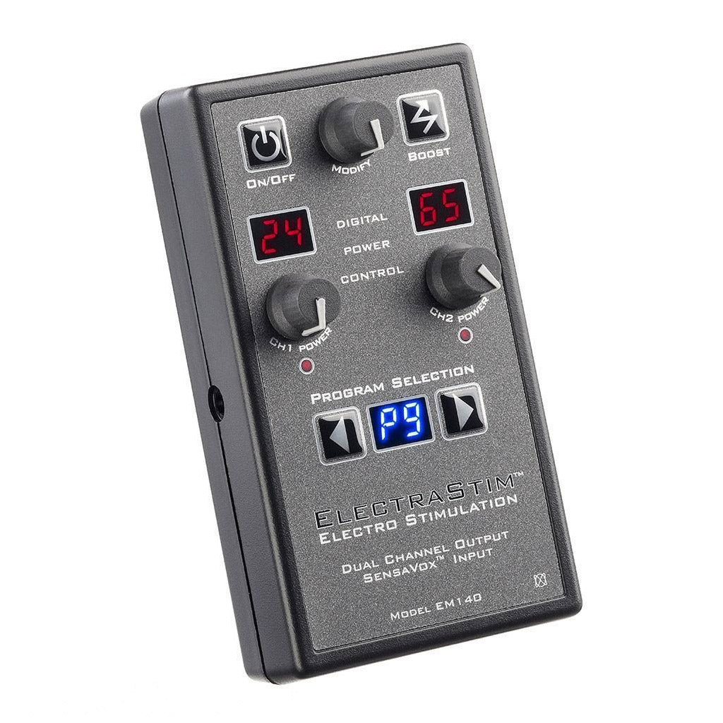 The Electrastim Sensavox is shown against a blank background. It is a grey remote with two small screens showing the control channels. It has three dials, one for each control power and one for “modify.” It has power, boost, and program selection buttons.