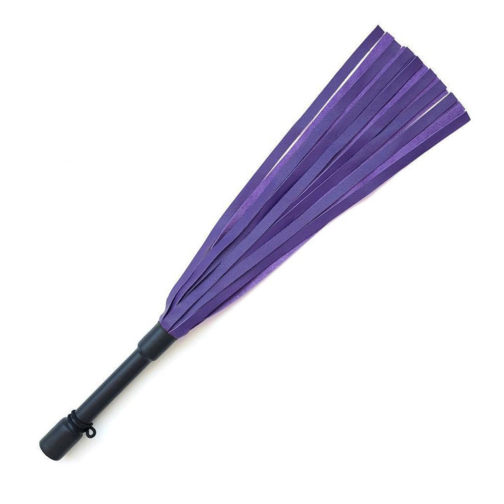 The Purple Devil Leather Flogger By Dragontailz is displayed against a blank background. The flogger has falls that are dark purple on one side and lighter purple on the other, as well as a black handle.