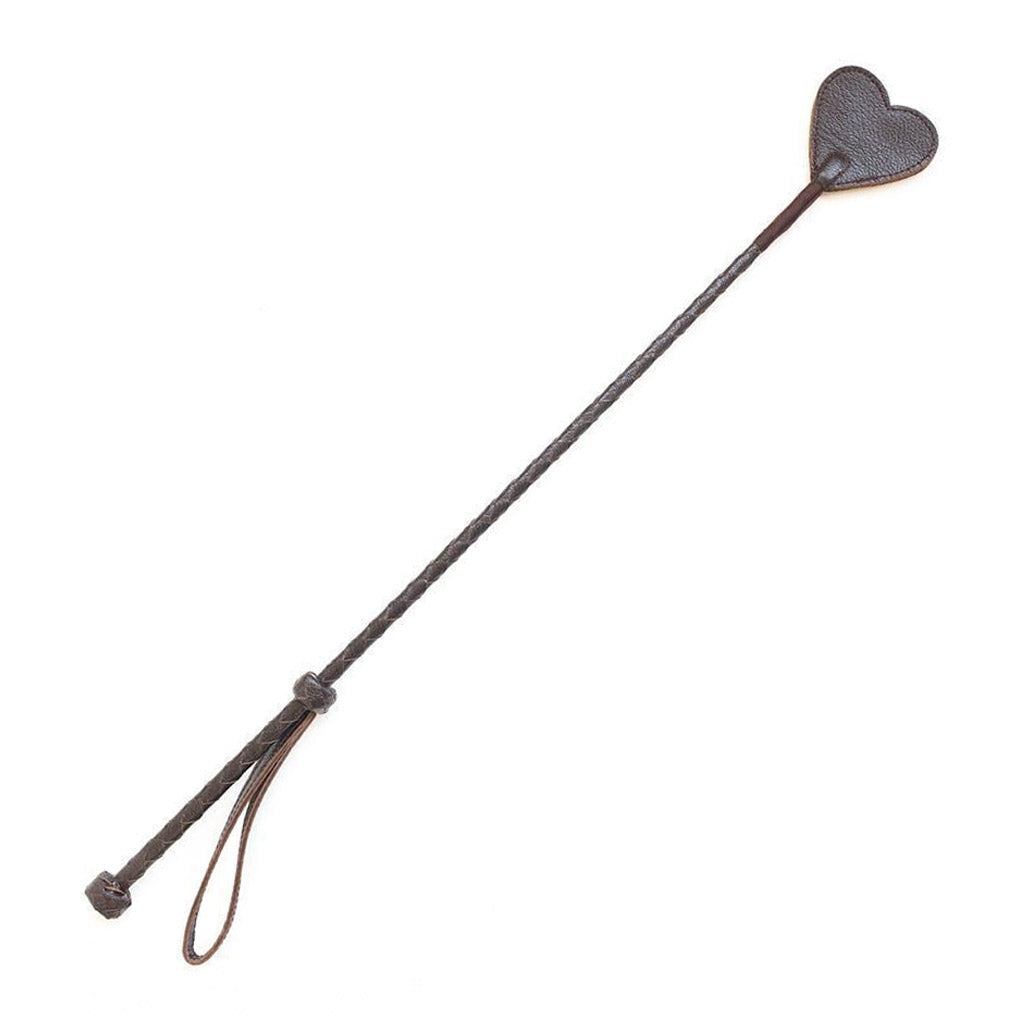 The Brown Leather Heart Crop is displayed against a blank background. The crop has a brown leather-wrapped handle and rod with a brown, heart-shaped piece of leather at the top.