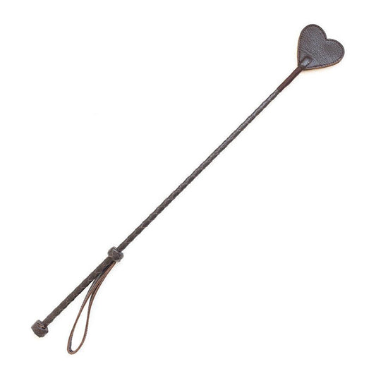 The Brown Leather Heart Crop is displayed against a blank background. The crop has a brown leather-wrapped handle and rod with a brown, heart-shaped piece of leather at the top.