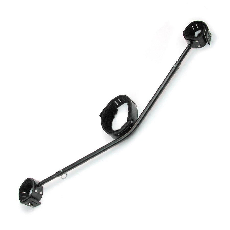 The black Adjustable Yoke is shown against a blank background. It is a black metal bar in a slight “V” shape. In the middle is a black leather fleece-lined collar, and the ends of the bar each have a matching cuff. The bar has pins at the ends to adjust the length.