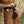 Load image into Gallery viewer, A close-up of a nude woman’s hips is shown. She wears the black leather Deluxe Locking Chastity Belt. It has a notched waist belt connected to a piece of leather between her legs. The belt is padlocked at the hips and pelvis.
