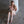 Load image into Gallery viewer, A nude blonde woman sits on a concrete floor, leaning against a concrete pole. Her arms are behind her back, and her ankles are chained together. She wears the Institutional Fleece Lined Blindfold and matching ankle cuffs.
