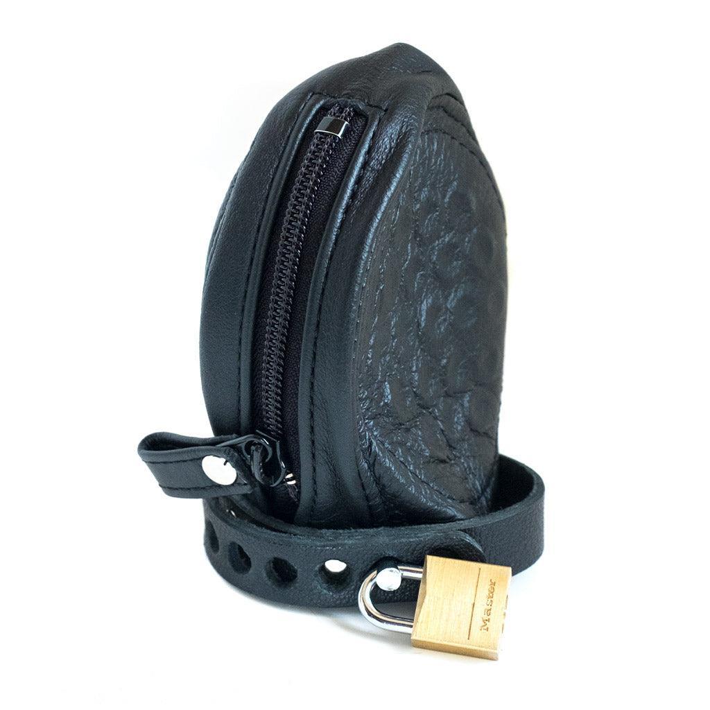 The Penis Prison With Pin Prick Lining and a Leather Cock Strap is displayed against a blank background.