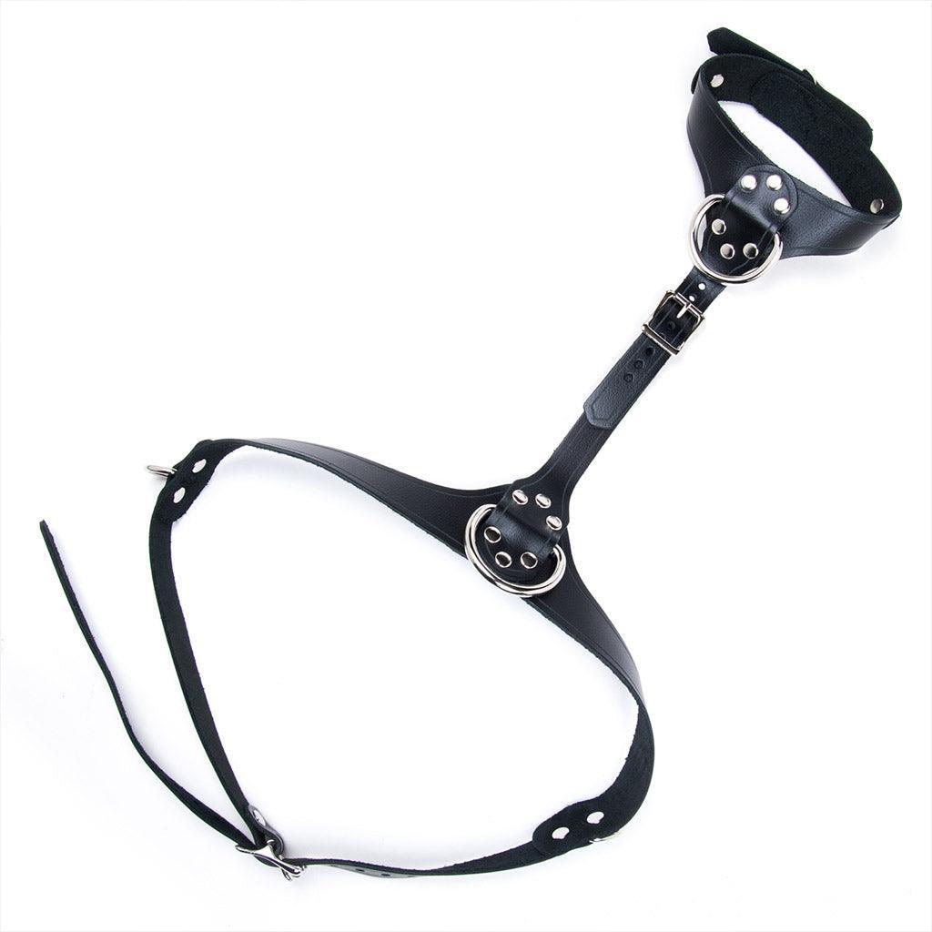 The leather Bust Harness is displayed against a blank background. It is made of black leather with silver hardware. The collar and underbust strap are both adjustable and buckle in the back. The middle strap also buckles and can be adjusted.